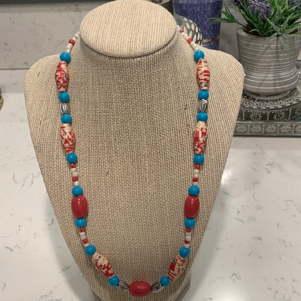 Turquoise color, red, white, and silver necklace